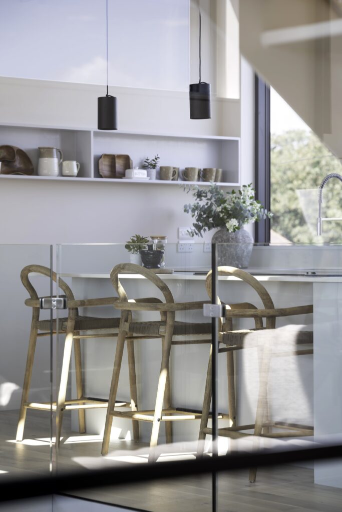 hampshire home staging for large seafront home with oak bar stools and decorative acccessories