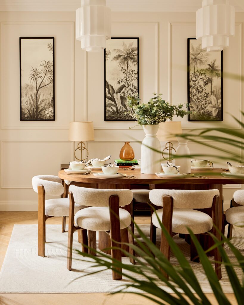 dining room with neutral walls and decorated with wooden furniture, beige boucle chairs and floral details
