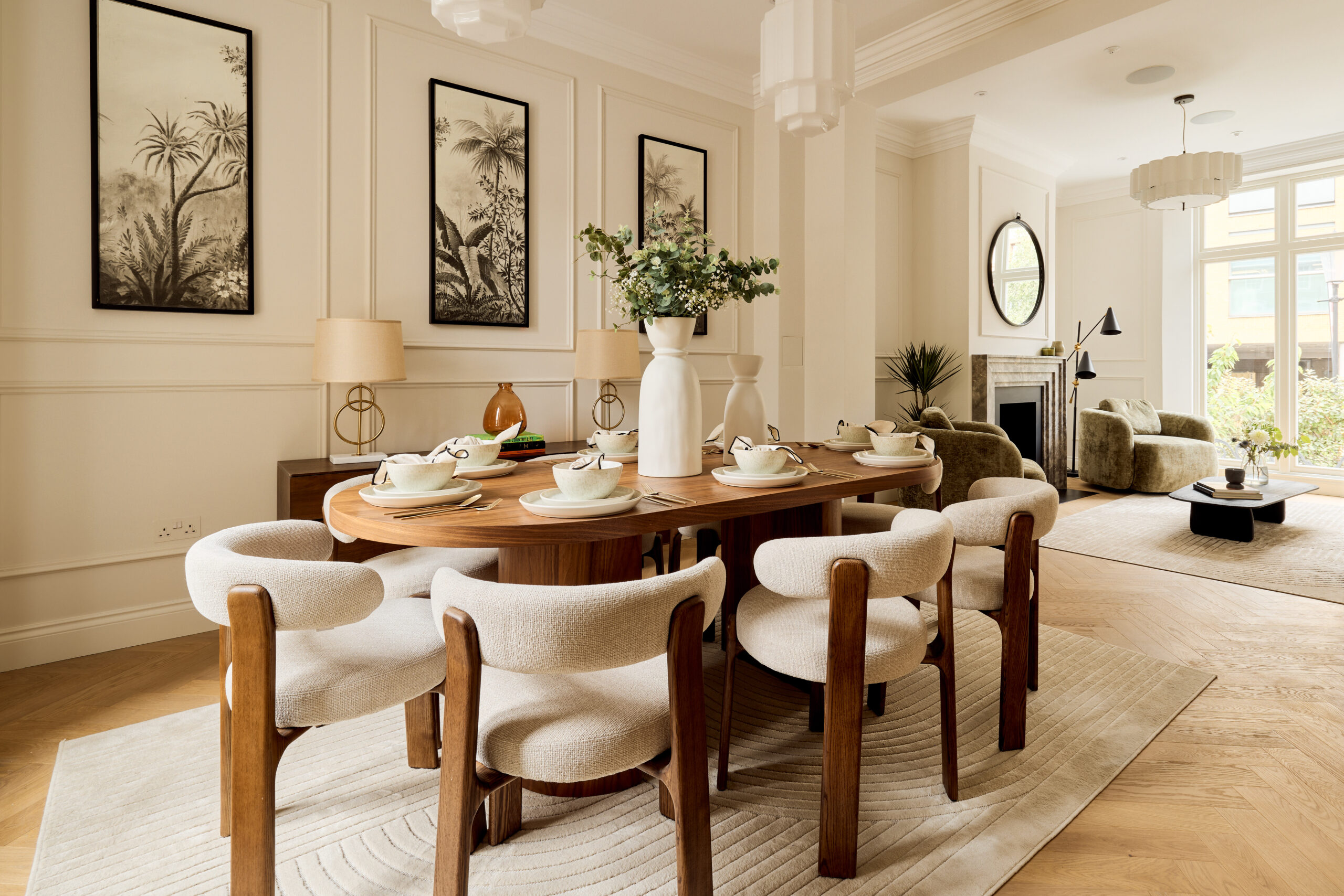 dining room with neutral walls and decorated with wooden furniture, beige boucle chairs and floral details