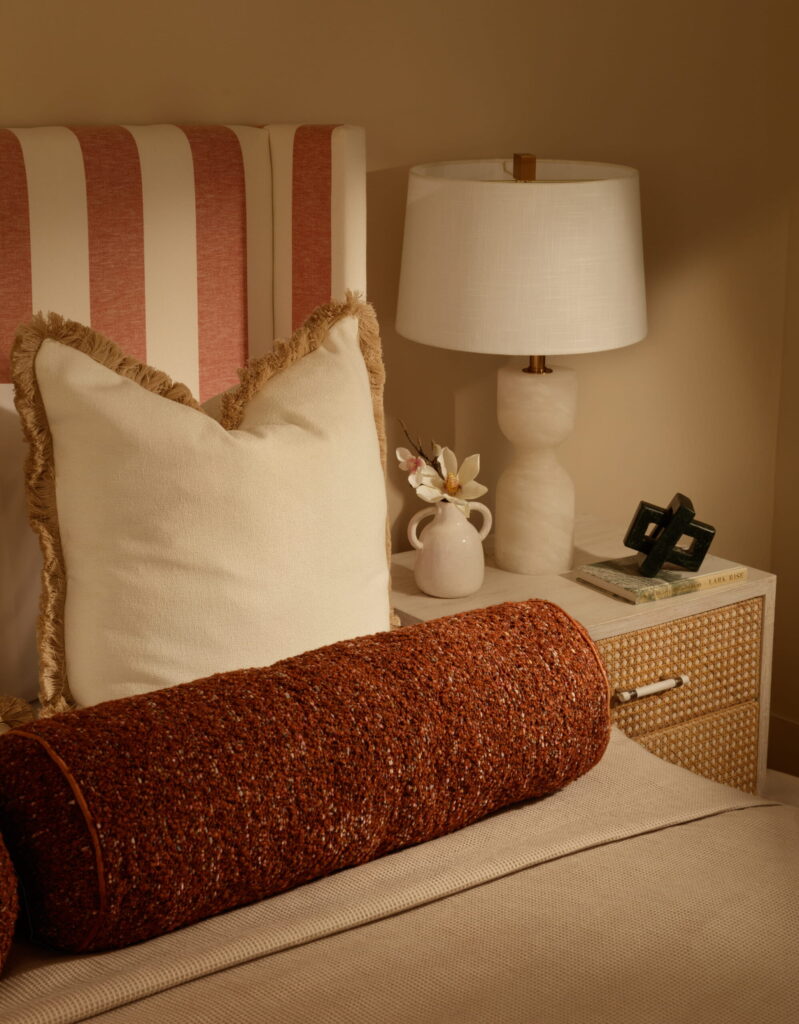 Bedroom styling detail from a home staging project by LJ Interiors featuring bespoke headboard